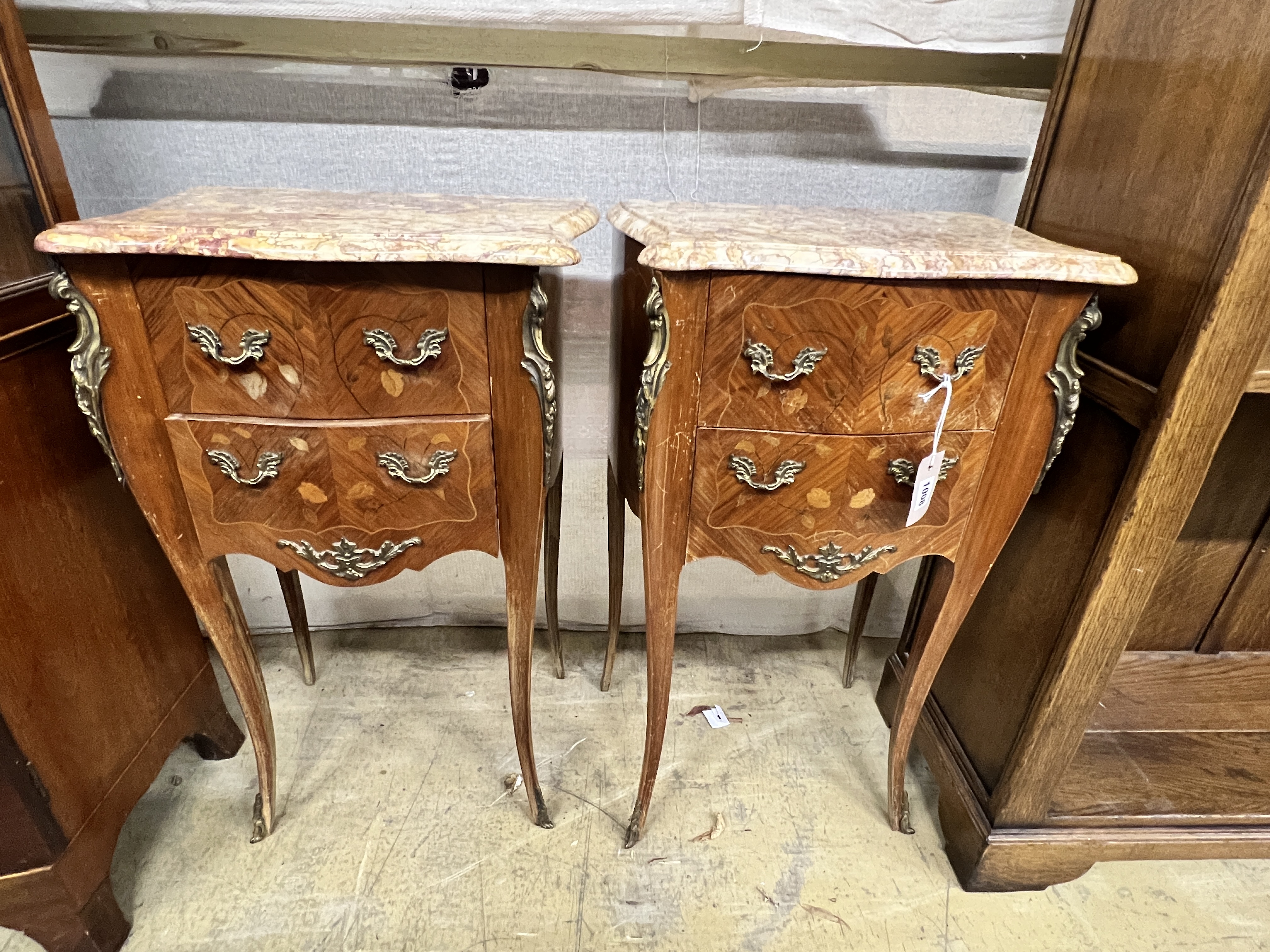 A pair of Louis XVI style inlaid kingwood marble top serpentine bedside chests, width 45cm, depth 31cm, height 73cm